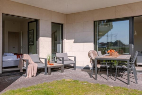 Modern ground-floor apartment with large sunny terrace and free parking place nearby Duinenwater